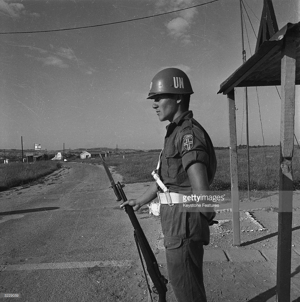 A United Nations Emergency Force officer manning a checkpoint on the border between Gaza and Israel